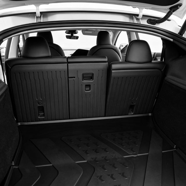 Soft-touch TPE matte texture on MoldedFit Tesla floor liner
