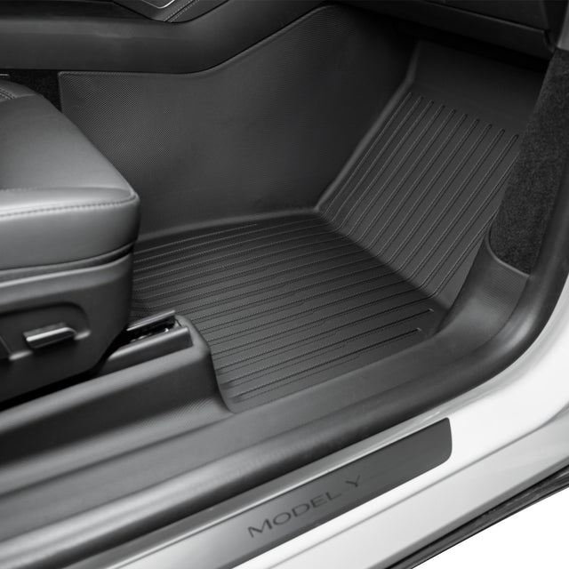 Tesla Model Y Juniper passenger floor mat with door sill protection — CabinProtect TPE liner